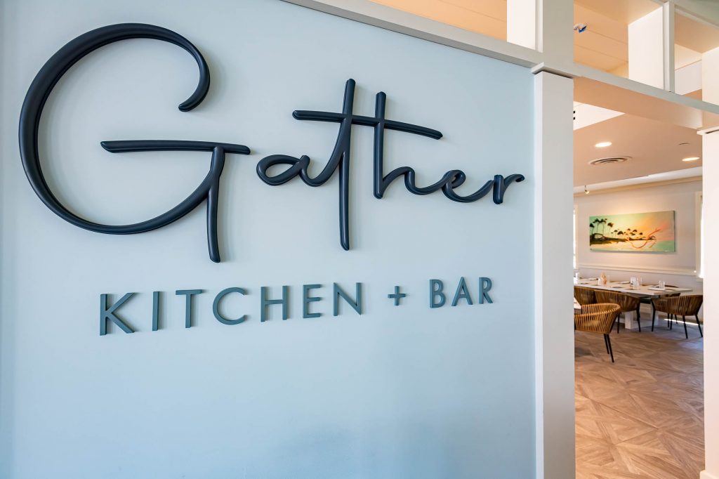 sign of gather kitchen and bar restaurant at watercolor inn