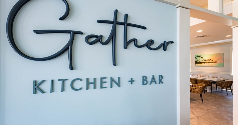sign of gather kitchen and bar restaurant at watercolor inn