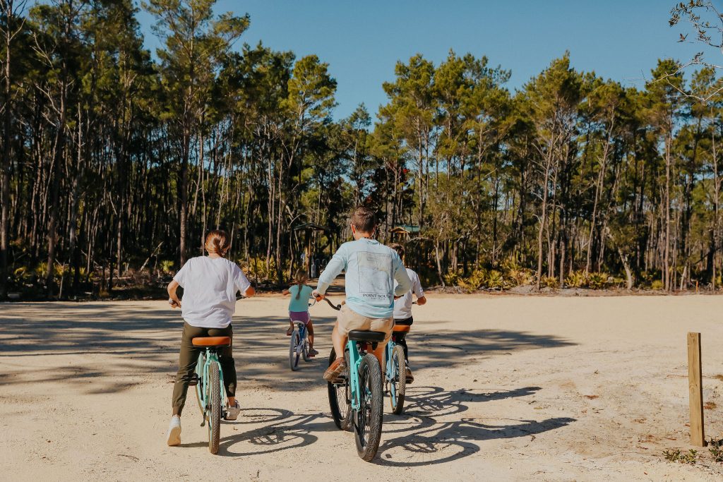 Family on bikes at the 30A Trailhead in Seagrove Beach