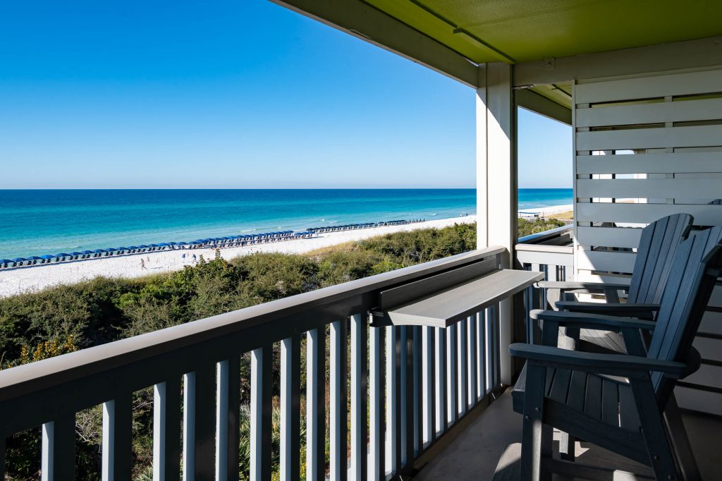 A spacious balcony overlooking the Gulf of Mexico and white sand beaches at WaterColor Inn