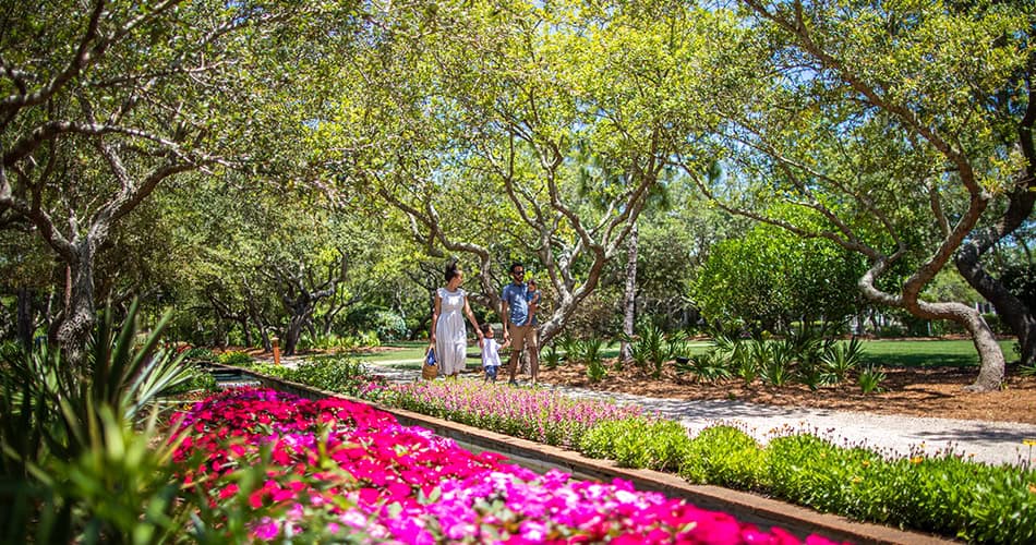 A family strolls the scenic trails of Cerulean Park on 30A